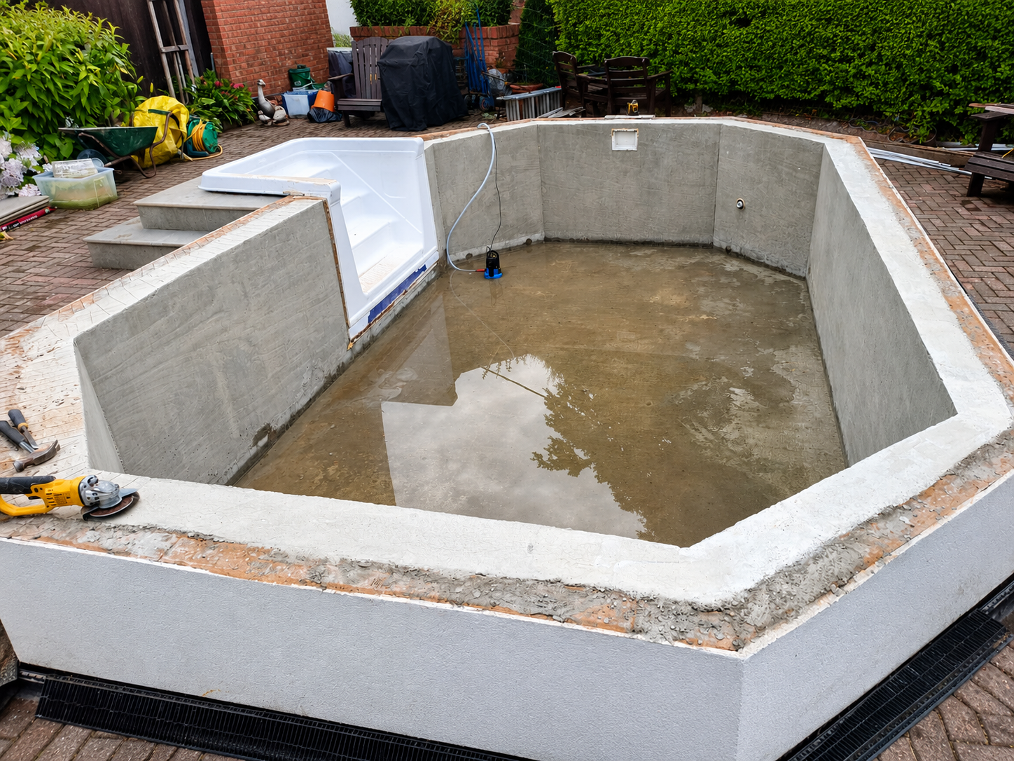 Before — Concrete swimming pool structure before finishing