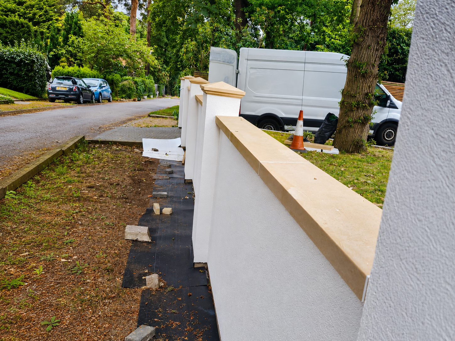 Boundary wall built alongside new paving